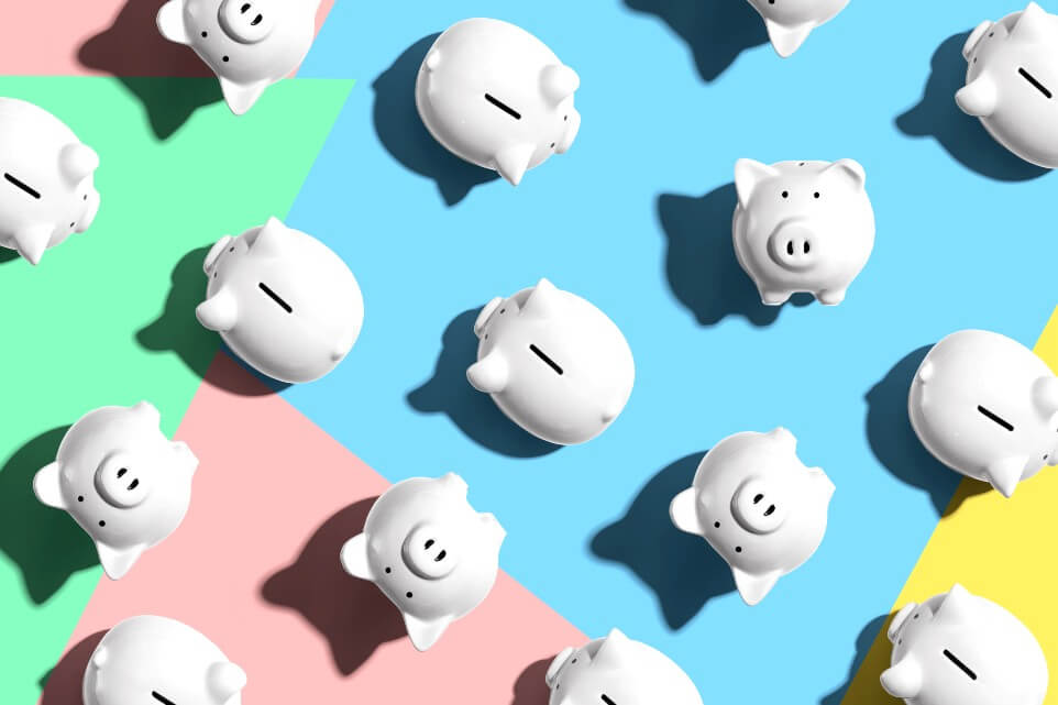 White piggy banks overhead view - flat lay