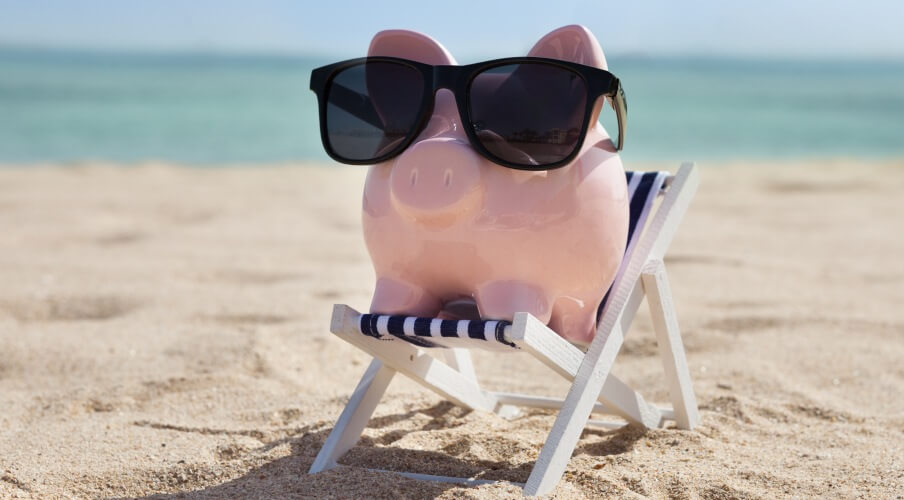 Piggy Bank On Deckchair With Sunglasses